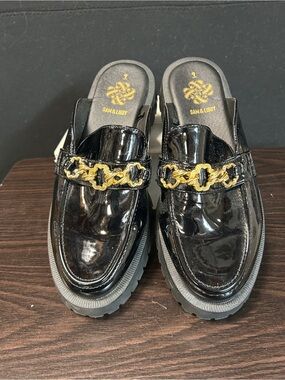 Sam & Libby Black Patent Mules with Gold Chain Accent